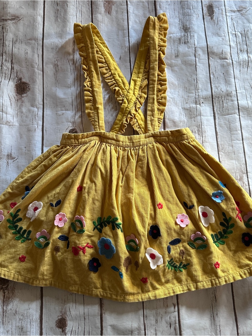 Mini Boden floral suspender skirt